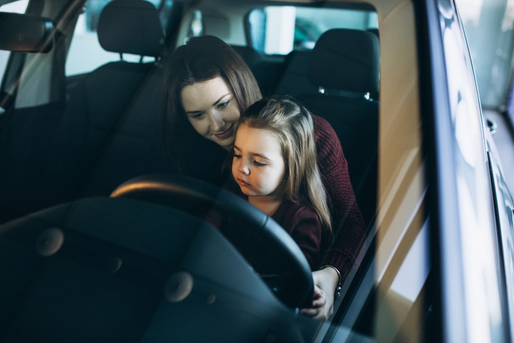 baby with mom in a car