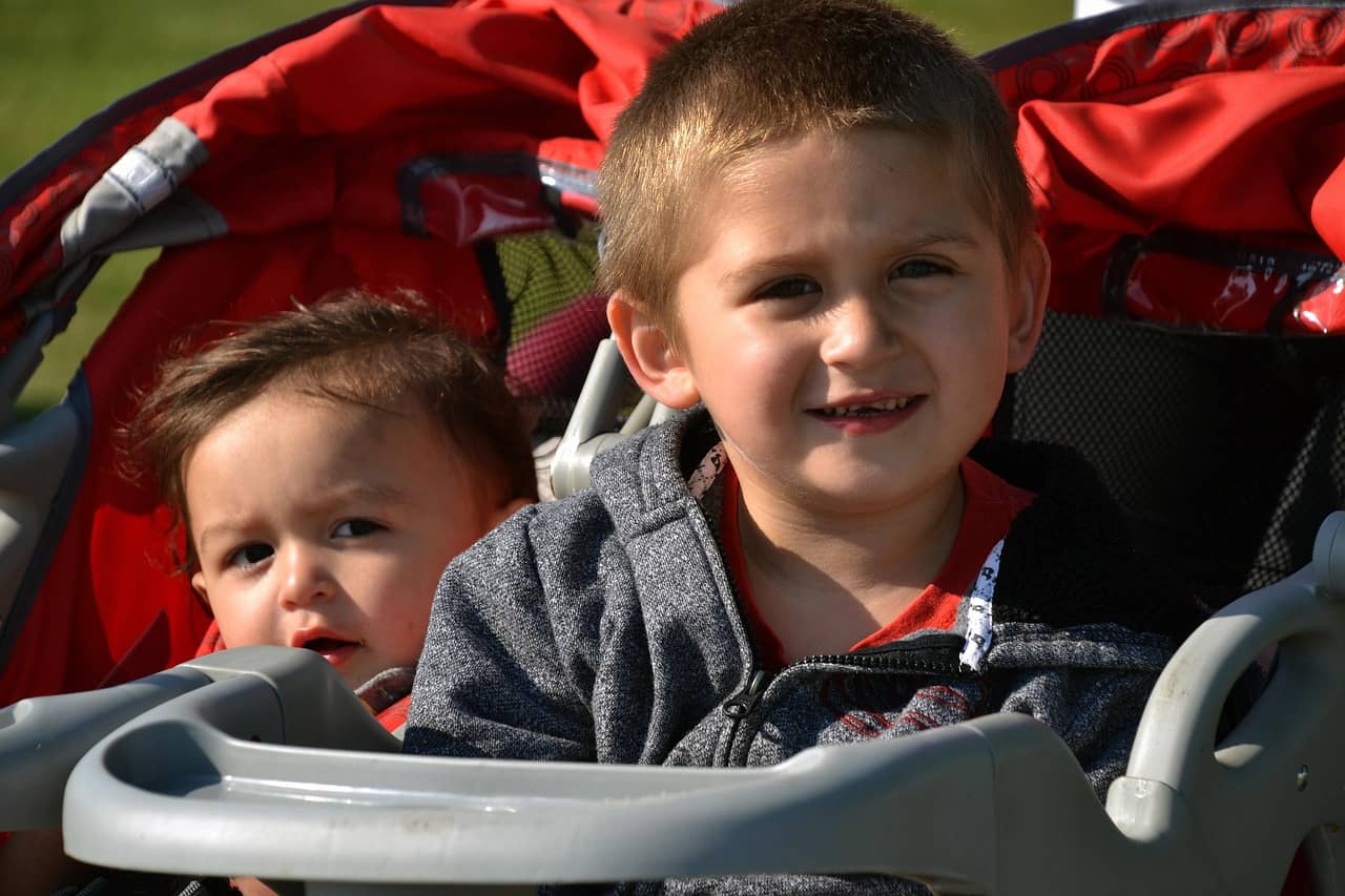 Two baby in double seated stroller